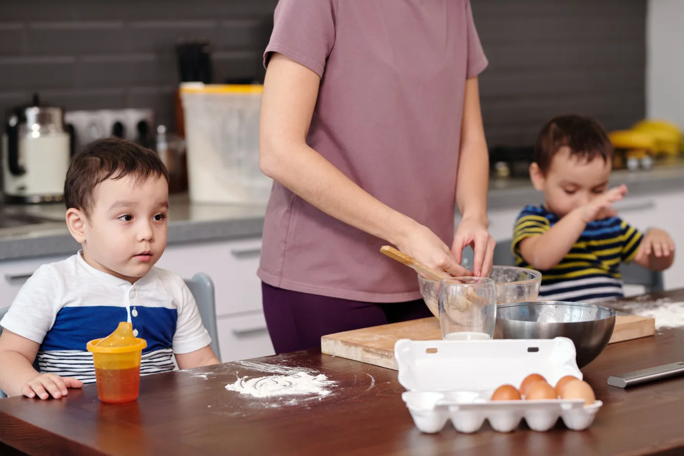 Parent preparing food with a child